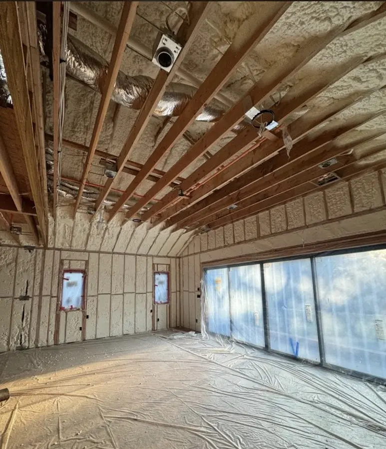Interior walls and ceiling insulated with spray foam during new construction in Herkimer